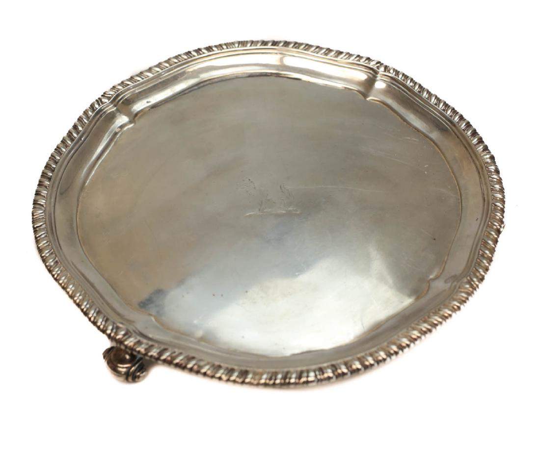 John Parker I Edward Wakelin Silver Tray Salver: John Parker I & Edward Wakelin George III London sterling silver footed tray salver , 1772. Hand chased indistinguishable armorial crest to the center. Braided texture rim along the edge. John Parker