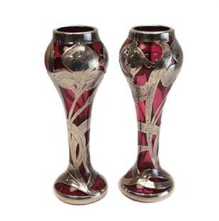 Pair Alvin Co Sterling Silver Cranberry Art Glass Vases: Pair Alvin Mfg Co sterling silver overlay on cranberry art glass vases #3266. Hand chased overlay leaves. Alvin silver marks to the base. Weight: 1 lb Measures: 6.25 inches tall Domestic Shipping: $35