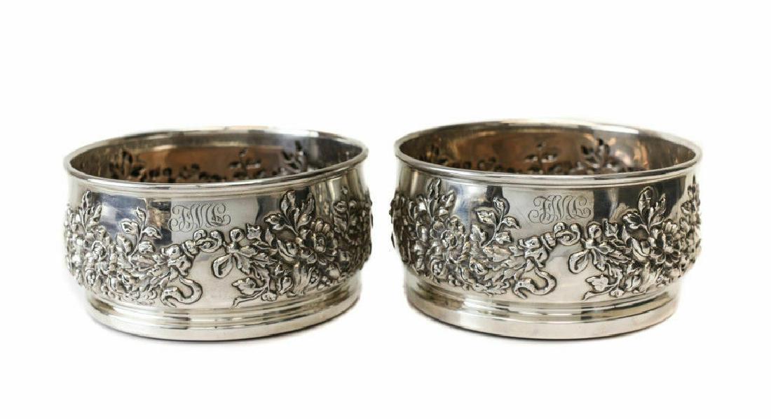 Mauser Mfg Company Sterling Silver Wine Coasters c1900: Mauser Mfg Company Sterling Silver Wine Coaster # 4603, circa 1900. Florals repelled to the walls with a 3 letter monogram indistinguishable towards the top border. Marked at the base. Weight approx.,