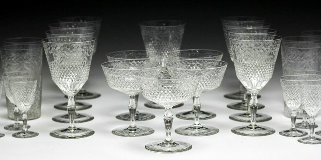 32 Kosta Cut Glass Crystal Goblets: Massive 32pc set of Kosta Cut Crystal Goblets / glassware / stemware, assortment - 9 Wine, 5 Champagne/Dessert, 9 Tumblers, 9 Sherry/Apertif. Some glasses marked 'Kosta Sweden' some unmarked. Diamond 