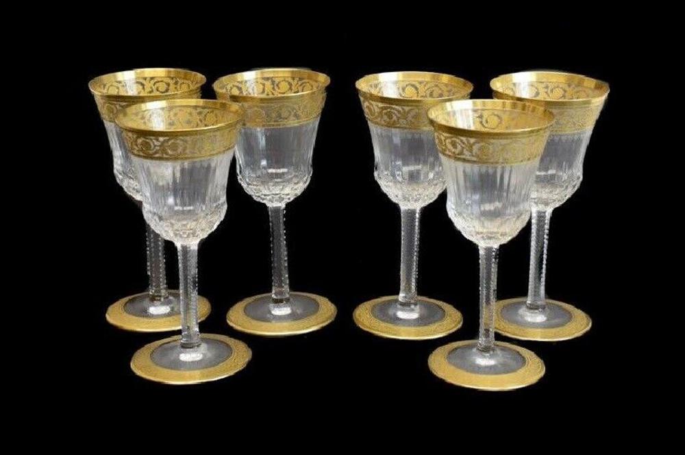 6 Saint Louis Sherry Wine Glasses in Thistle Gold: 6 Saint (St Louis) crystal sherry wine glasses in Thistle Gold. Acid etched Saint Louis mark to the underside base. Each piece gold encrusted, notched with multisided stem. Measures Approx., 5 inches 