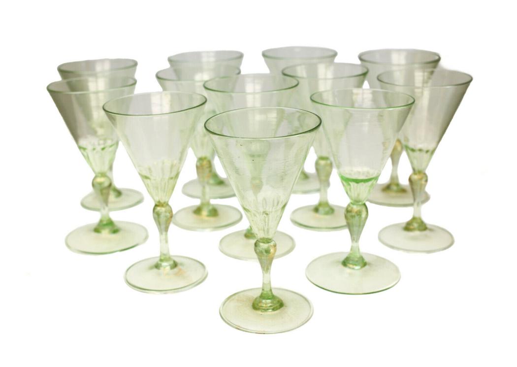 12 Venetian Green & Gold Fleck Art Glass Wine Goblets: 12 Venetian pink green glass wine goblets, circa 1970. Beautiful green and gold flecks throughout. Weight Approx., 2 lbs Measures Approx., 3.25 inches diameter x 5.75 inches tall Domestic Shipping: $6
