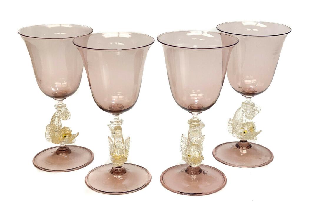 4 Salviati Amethyst Dolphin Stem Wine Goblets c1960: 4 Salviati Venetian amethyst & gold fleck wine goblets, circa 1960. Gold fleck dolphin stems. Weight Approx., 1 lb Measures Approx., 3.5 inches diameter x 6.825 inches tall Domestic Shipping: $40