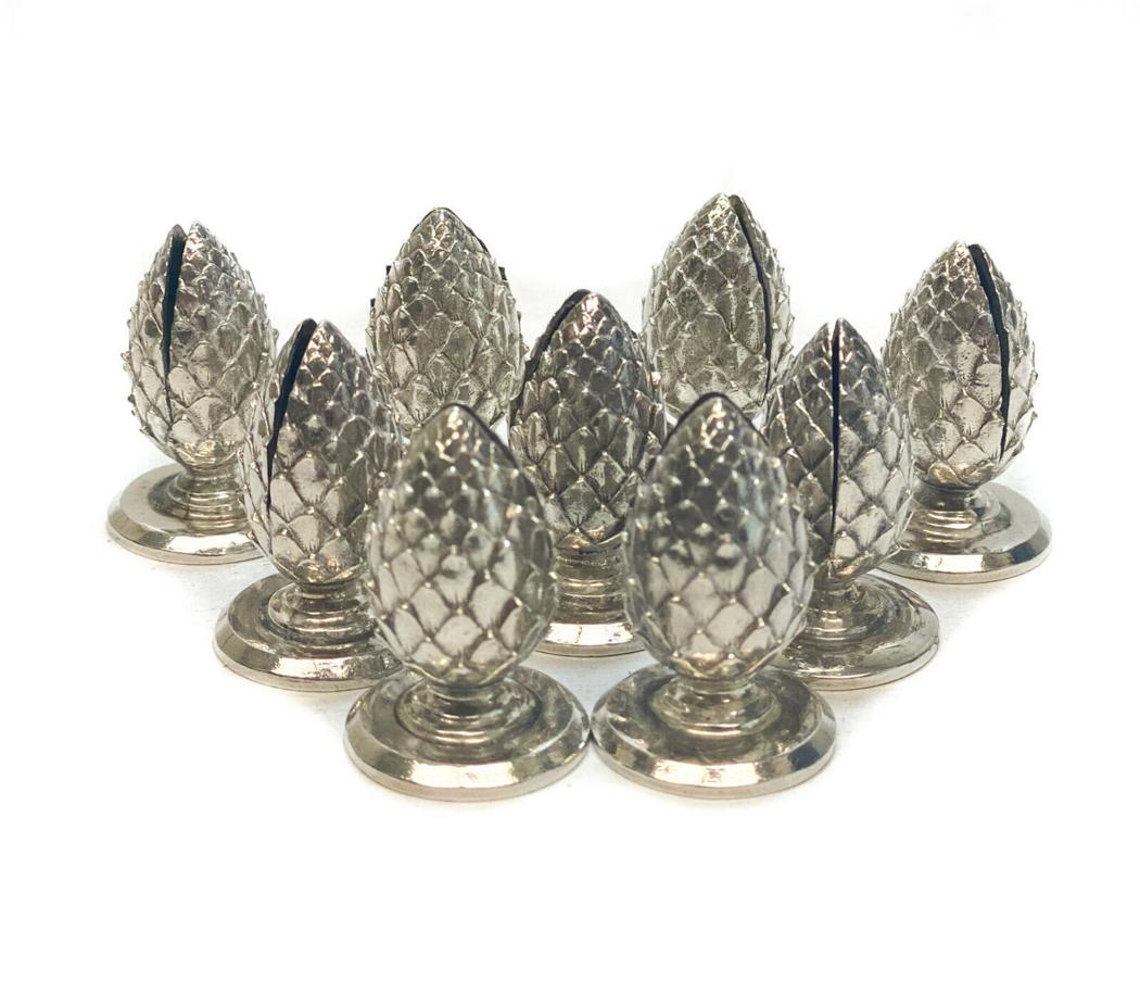 9 Tiffany & Co. Sterling Silver Place Card Holders: Tiffany & Co. Makers sterling silver pineapple form place card holders. Tiffany & Co. silver marks to the underside. Weight Approx., 6.06 ozt Measures Approx., 1 inchDomestic Shipping: $20