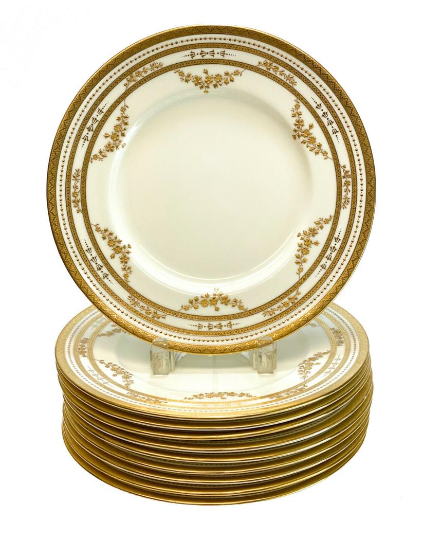 10 Minton Tiffany Gilt Encrusted Dinner Plates: 10 Minton for Tiffany & Co. England porcelain gilt encrusted dinner plates, 1920. Gilt encrusted floral swags with beaded accents. Minton England for Tiffany & Co. marks to the underside dated to 1920