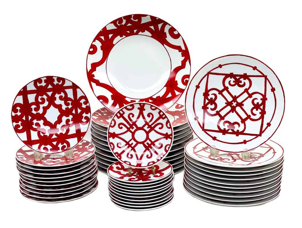 Hermes Dinner Set for 12 in Balcon du Guadalquivir: A gorgeous 48 piece Hermes Paris porcelain dinner service for 12 in Balcon du Guadalquivir. Red scrolls and lines throughout the dishes. Each plate signed "Hermes Paris" to the front and Hermes stamp 
