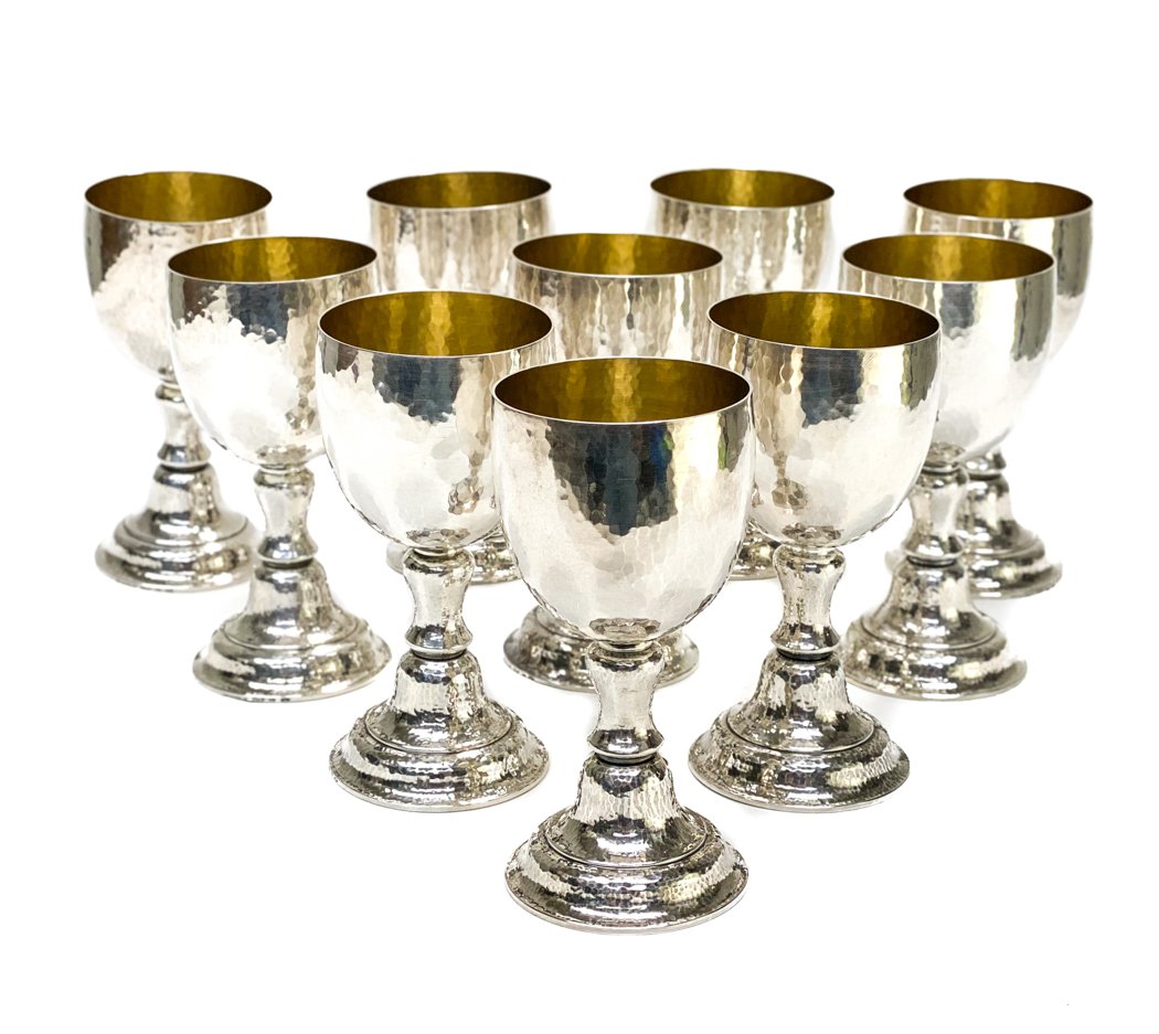 10 Buccellati Italian Sterling Silver Wine Goblets: 10 finely hand hammered Italian Sterling Silver Wine Goblets by Mario Buccellati, with vibbrant gilt interiors and stepped stems. Marked Mario Buccellati the underside rim. Weight Approx., 54.33 ozt M
