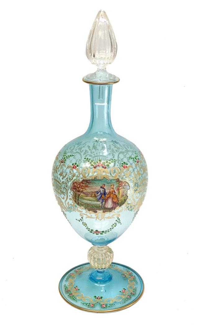 Venetian Art Glass Hand Painted Enamel Wine Decanter: Venetian blue art glass hand painted enamel wine decanter, circa 1930. Hand painted courting figures tot he central area with gilt foliate scrolls and rose accents. Weight Approx., 1.5 lb Measures App