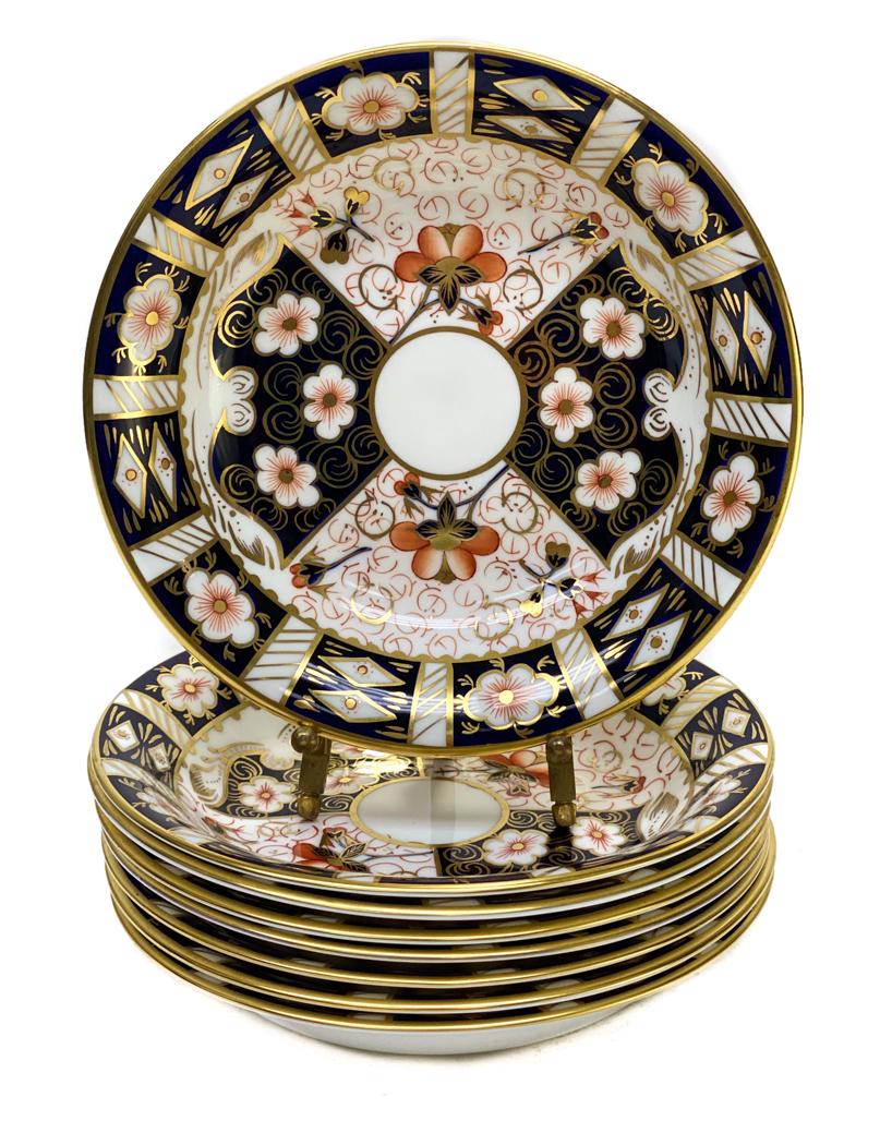 8 Royal Crown Derby Porcelain Plates Bowls in: Royal Crown Derby porcelain bowls in Traditional Imari #2451. Blue panels, gold accents, and rust flowers throughout. Royal Crown Derby mark to the underside. Weight Approx., 2 lbs Measures Approx., 6