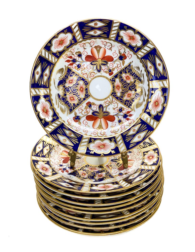 10 Royal Crown Derby Porcelain Bread Plates in: 10 Royal Crown Derby Porcelain Bread Plates in Traditional Imari #2451. Blue panels, gold accents, and rust flowers throughout. Royal Crown Derby mark to the underside. Weight Approx., 4 lbs Measures 