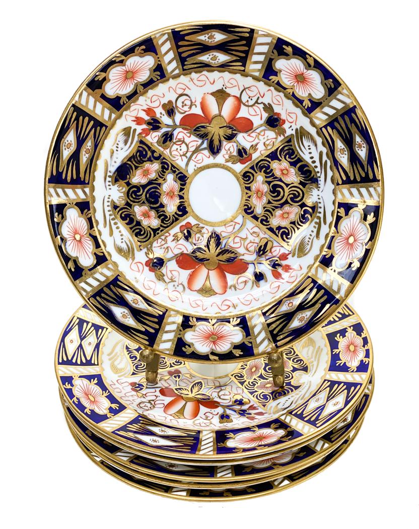 6 Royal Crown Derby Porcelain Bread Plates in: 6 Royal Crown Derby Porcelain Bread Plates in Traditional Imari #2451. Blue panels, gold accents, and rust flowers throughout. Royal Crown Derby mark to the underside. Weight Approx., 2 lbs Measures A