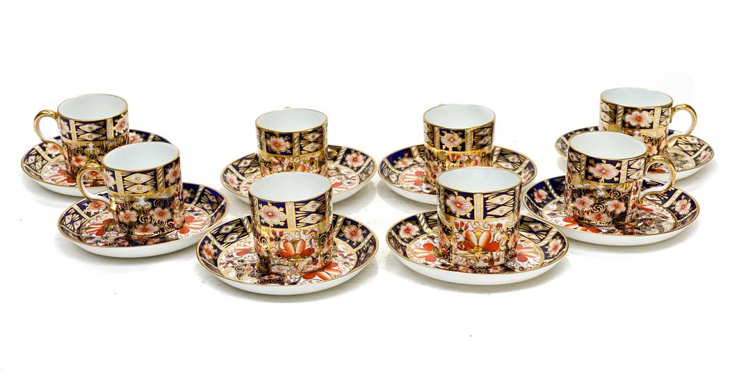 8 Royal Crown Derby Porcelain Cup and Saucers in: 8 Royal Crown Derby Porcelain Demitasse Cup and Saucers in Traditional Imari #2451. Blue panels, gold accents, and rust flowers throughout. Royal Crown Derby mark to the underside. Weight Approx., 4 l
