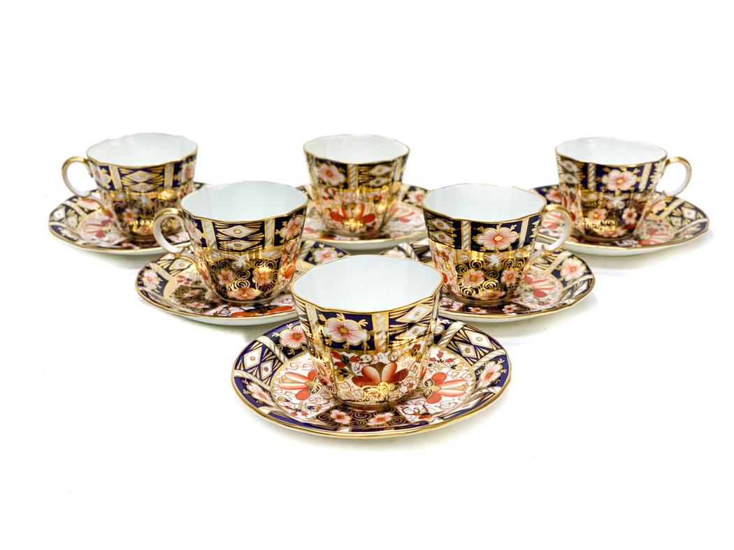 6 Royal Crown Derby in Traditional Imari Cup and: 6 Royal Crown Derby in Traditional Imari Cup and Saucers #2451.Blue panels, gold accents, and rust flowers throughout. Royal Crown Derby mark to the underside. Weight Approx.,5 lbs Measures Approx, Cu