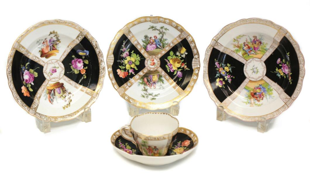 Dresden & Meissen Soup Bowls & Cup & Saucer. Quatrefoil: Mixed Dresden & Meissen hand painted rimmed soup bowls and cup & saucer. Charming hand painted quatrefoil courting scenes with a black ground. Hand painted floral accents with gilt swirls. Mixed Dresd
