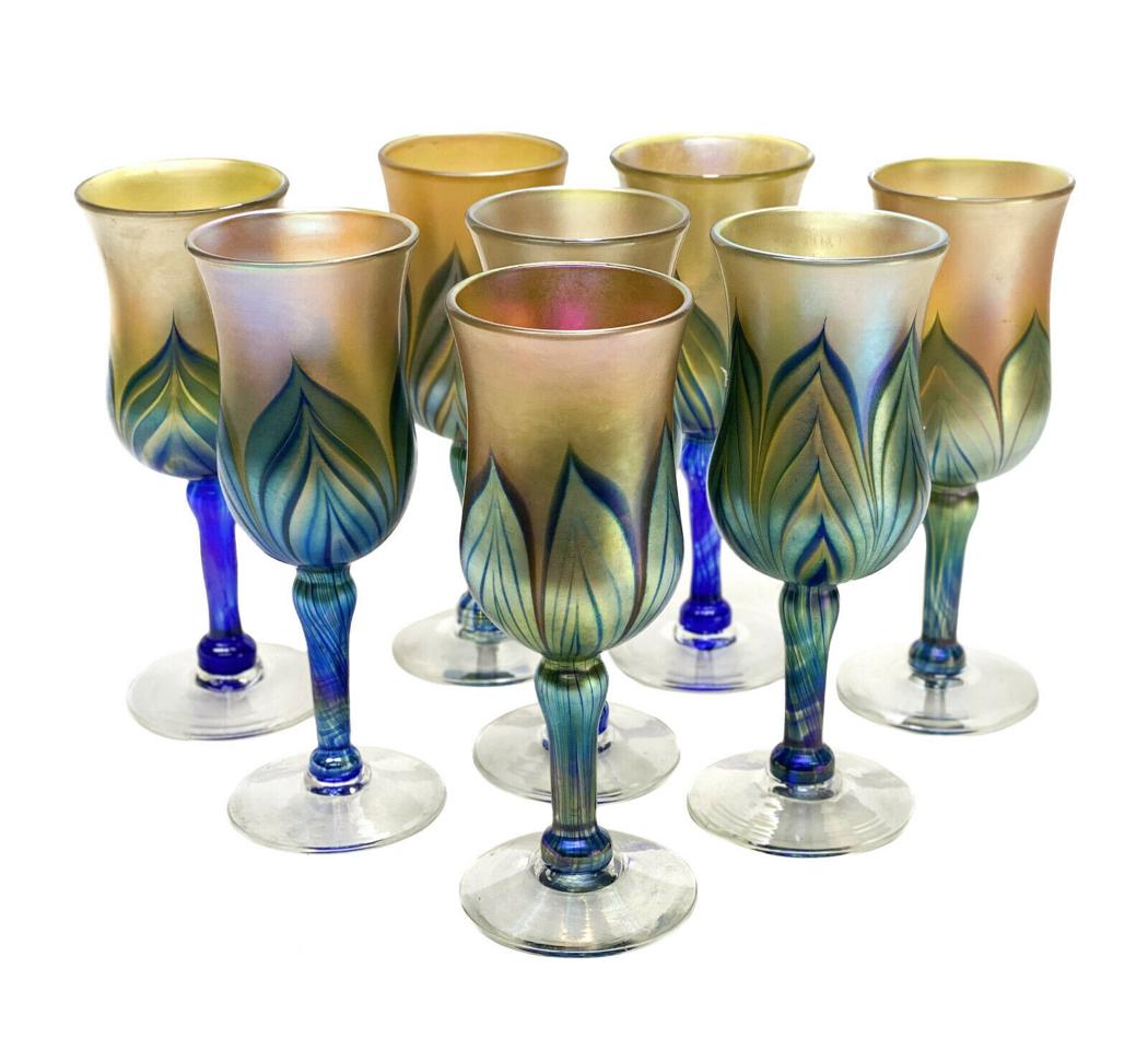 8 Lundberg Studio Glass Iridescent Blue Gold Pulled: 8 Lundberg Studio Glass iridescent blue gold pulled feather wine goblets, circa 1980. Pulled feathered design to the body of the goblets down to the stem. Clear bases. Lundberg mark to the underside. 