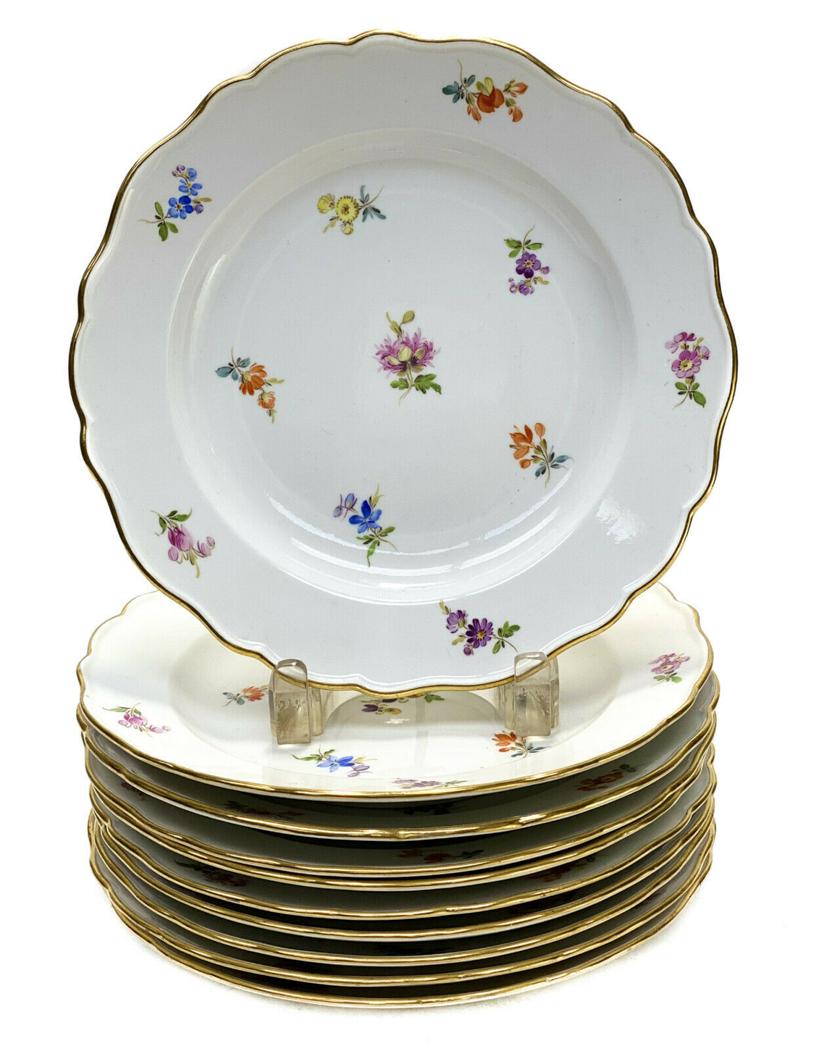 10 Meissen Germany Porcelain 9.125 inch Plates: 10 Meissen Germany porcelain 9.125 inch plates. Hand painted flowers to the center and around the scalloped rimmed edge. Meissen Germany mark to the underside. Weight Approx., 10 lbs Measures Approx.,