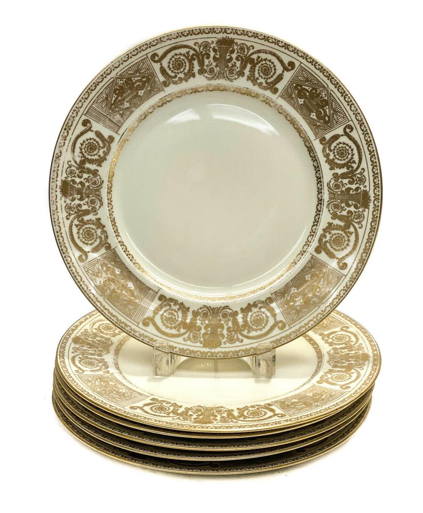 6 Crown Lion Ivory Selb Bavaria Porcelain Dinner Plates: 6 Crown Lion Ivory Hutchenreuther Selb Bavaria porcelain dinner plates, circa 1940. Gilt floral pillars and leaves with urns to the rims. Crown Lion Ivory marks to the underside. Weight Approx., 8 lbs