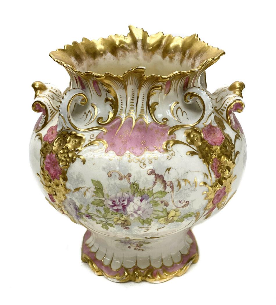 Crown Derby China Porcelain Vase, 19th Century: Crown Derby China porcelain vase, 19th Century. A pink and white ground with hand painted florals to the central area. Gilt to the twin handles and to the top and base rims. Crown Derby mark to the un