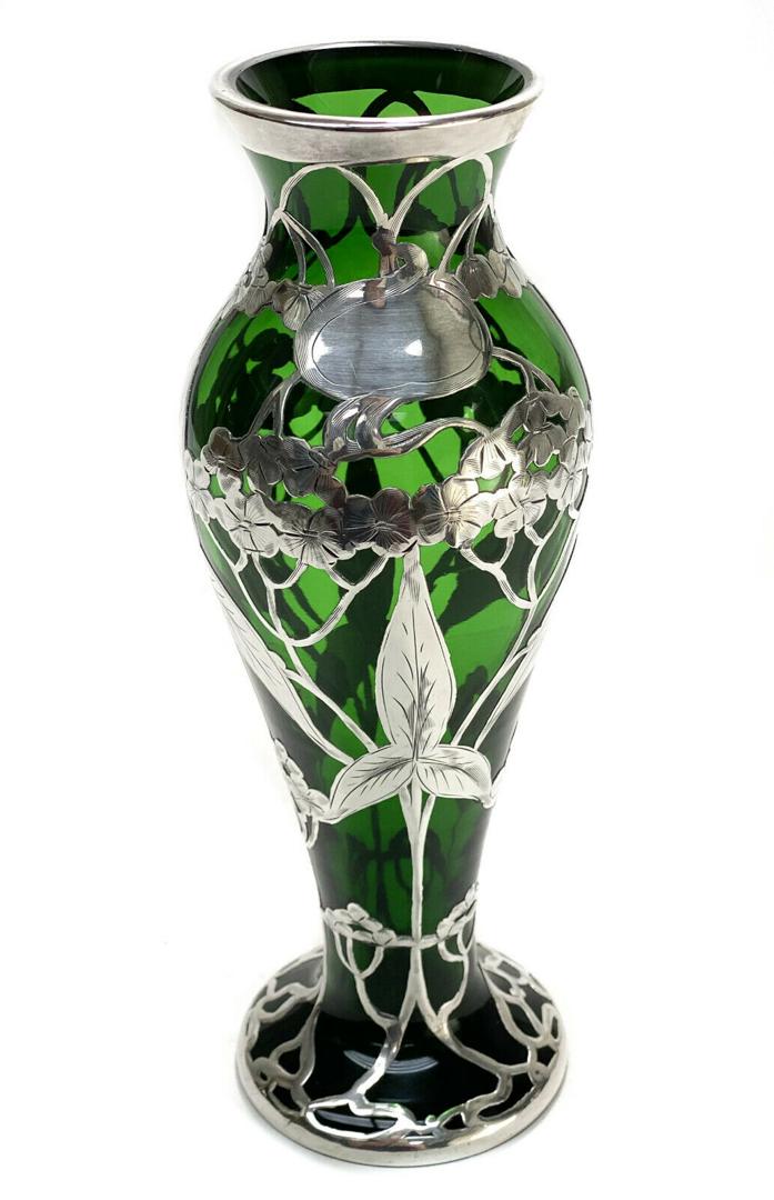 American La Pierre Silver Overlay Green Art Glass Vase: American La Pierre silver overlay green glass vase, circa 1900. Floral overlay throughout and with an open monogram to the circular band towards the top rim. A faint "L" mark to the base, likely for L