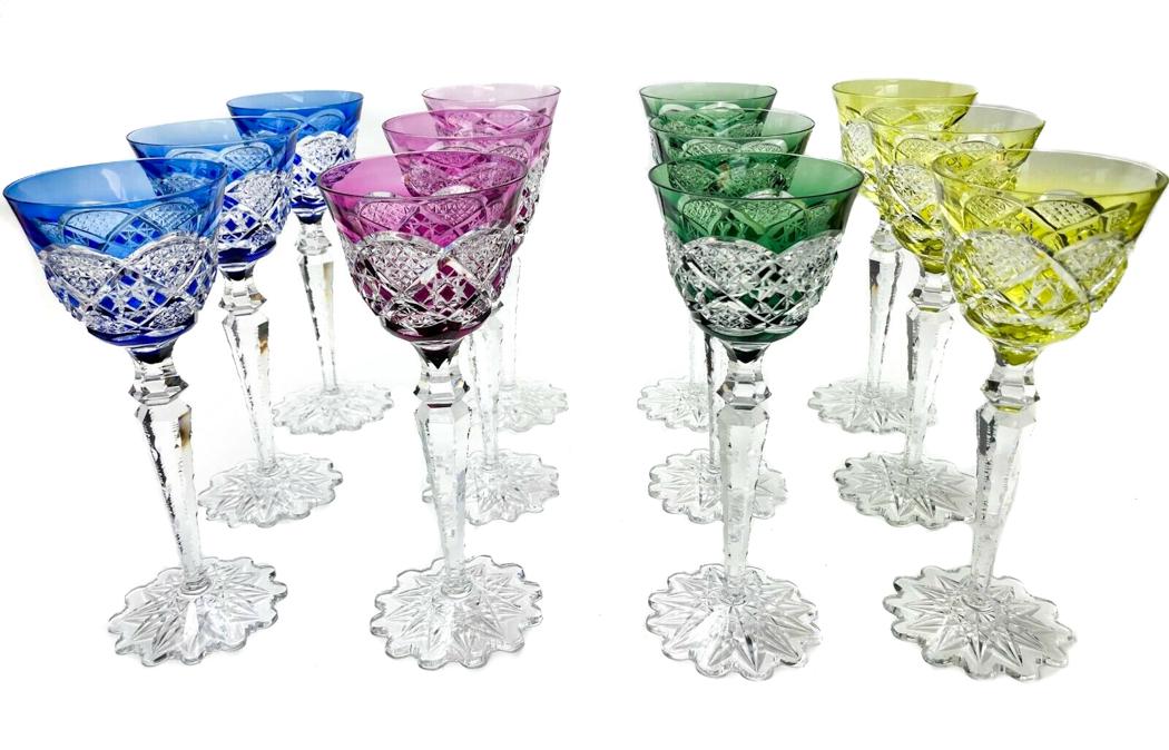 Val Saint Lambert, Belgium - Set of 12 Verrept Crystal: A set of 12 wine goblets signed Val Saint Lambert, Belgium. Mid 20th century in "Verrept" style. Features ornate notched cut to clear crystal with colorful overlays in cobalt, cranberry, emerald, and 