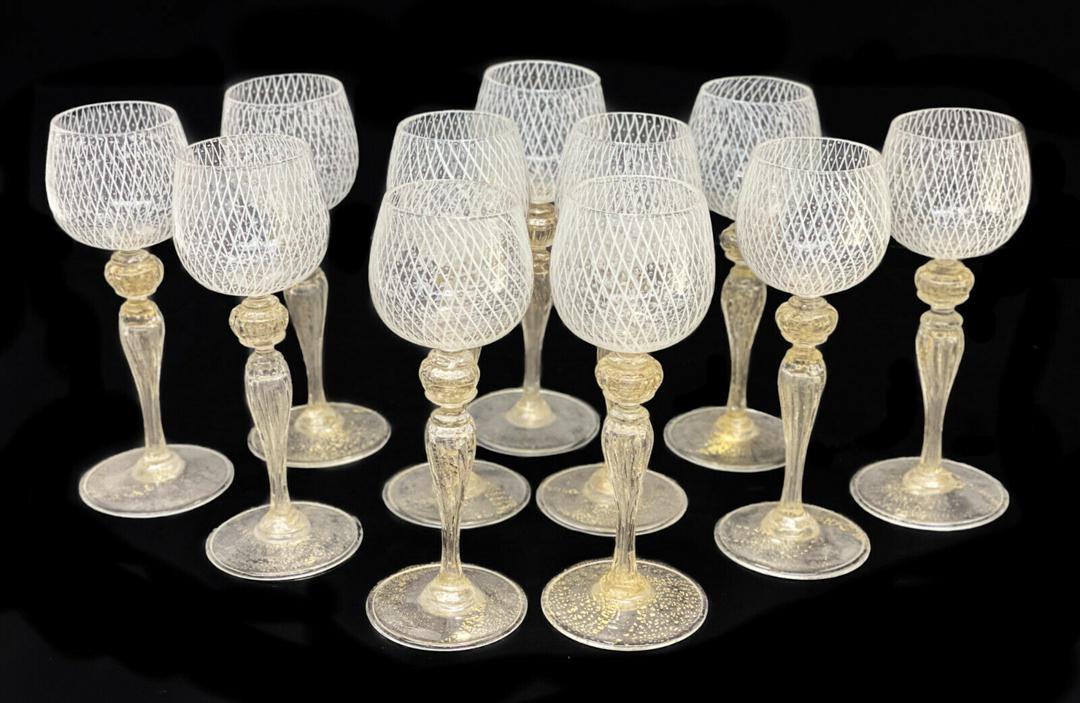 11 Venetian White Latticino Striped Cordial Wine: 11 Venetian white latticino striped cordial wine goblets, circa 1960. White latticino stripes to the bowls of the goblets. Gold fleck to the bulbous stems and bases. Weight Approx., 2 lbs Measures App