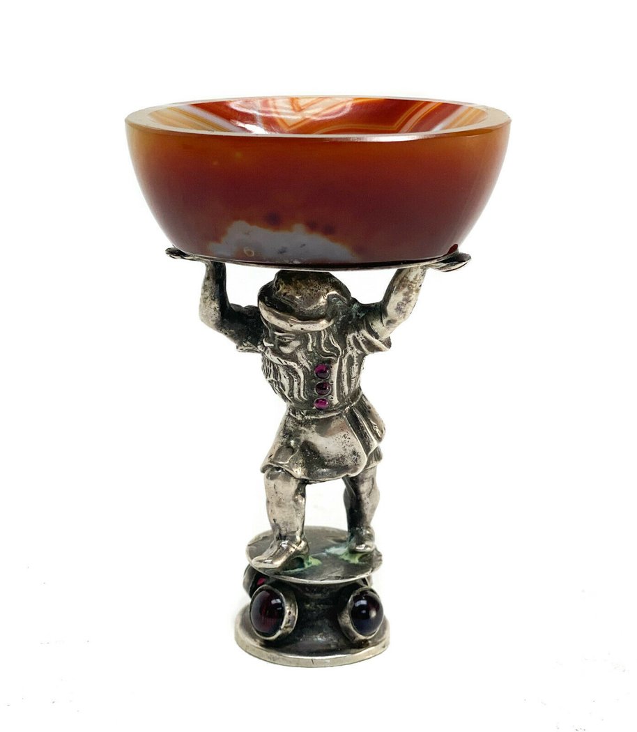 Continental Orange Agate Silver Open Salt Cellar: Continental Orange Agate and silver figural open salt cellar, circa 1900. The open salt cellar depicts a figural bearded gnome to the stem holding up the Orange Agate bowl. Applied cabochon Amethyst a