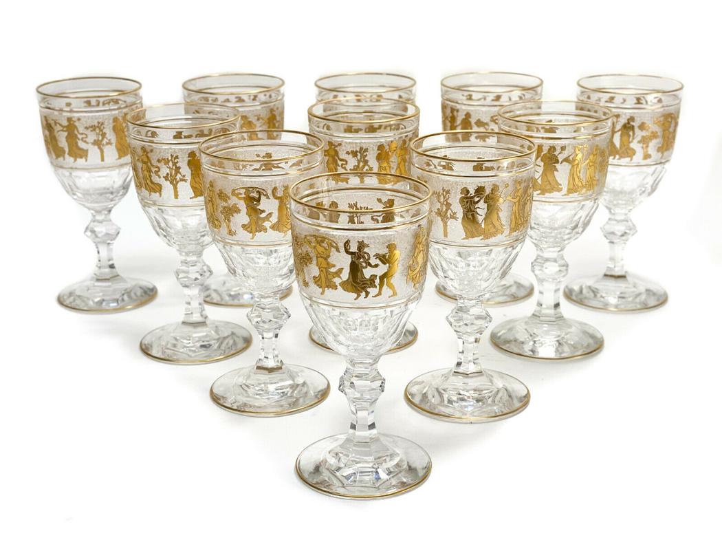 11 Val St Saint Lambert Glass Wine in Danse De Flore: 11 Val St Saint Lambert cut glass wine goblets in Danse De Flore clear. Beautiful gilt antiquity dancing scenes to the frosted circular band. Weight Approx., 10 lbs Measures Approx., 3 inches diameter