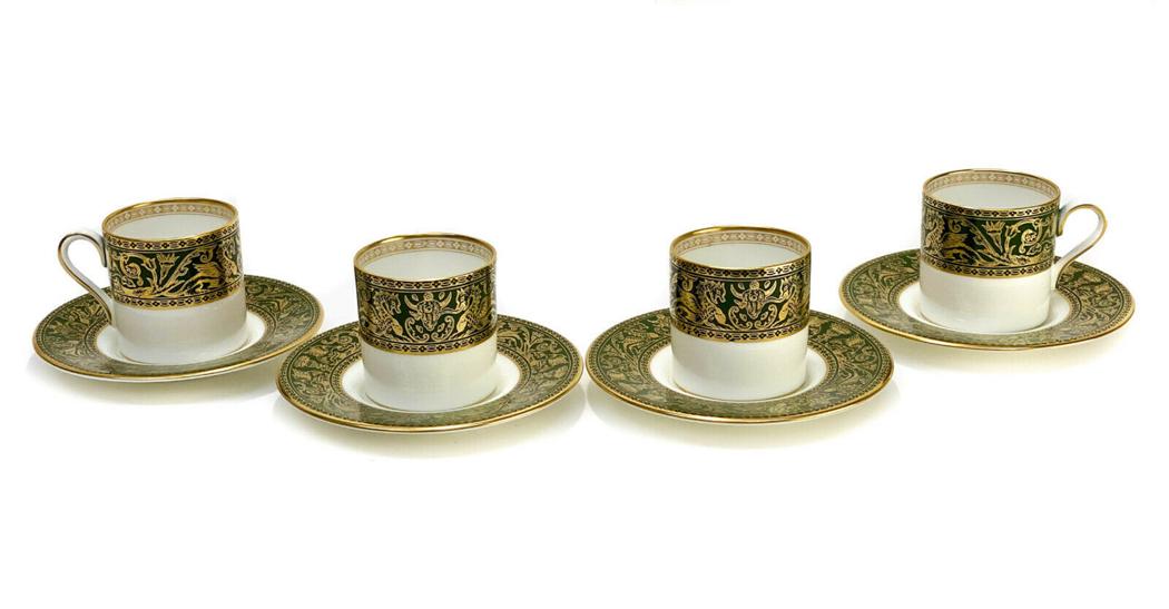 4 Wedgwood Porcelain Cup & Saucers in Green Florentine: 4 Wedgwood England porcelain demitasse cup & saucers in Green Florentine, circa 1960. A hunter green ground to the rims with gilt dragons and foliate scrolls throughout. Wedgwood England mark to the u