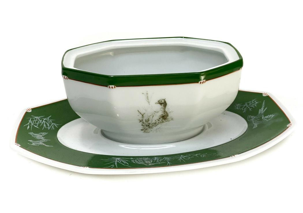 Hermes France Porcelain Chasse Green Gravy Boat: Hermes France porcelain Chasse Green gravy boat. A hunter ground with with various birds throughout. Hermes mark to the underside base. Weight Approx., 1 lbs Measures Approx., 8.75 inches x 5.75inches
