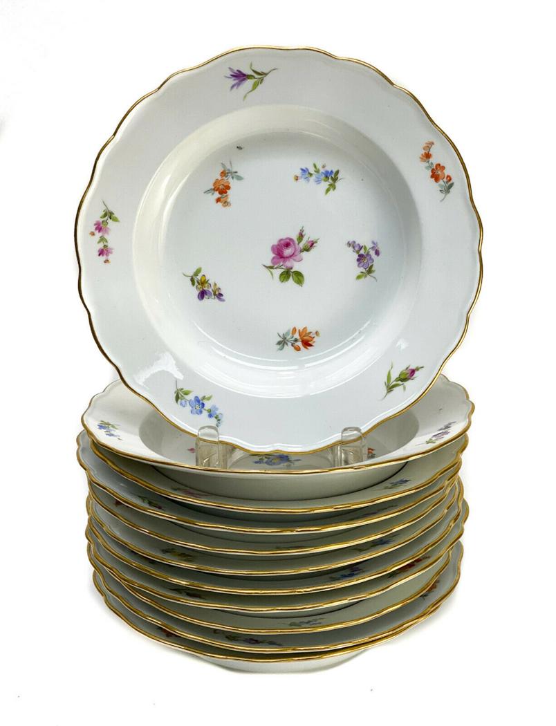 11 Meissen Porcelain Hand Painted Rimmed Soup Bowls: 11 Meissen Germany porcelain hand painted rimmed soup bowls. Various hand painted florals throughout. Gilt to the scallop rimmed edge. 1st quality Meissen marks to the underside base. Weight Approx., 