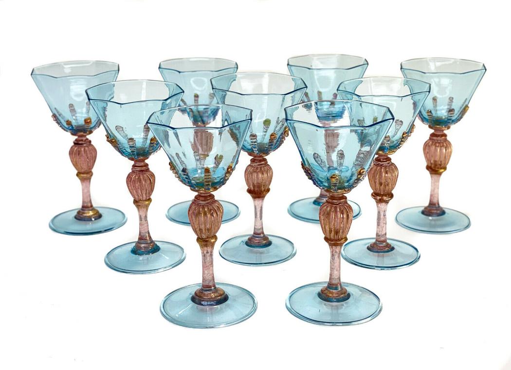 9 Salviati Cranberry Red & Blue Threaded Art Glass Red: 9 Salviati cranberry red & blue threaded art glass red wine goblets, circa 1940. Turquoise blue hues to the octagonal lobed bowls and base with a gold fleck cranberry red swirled stem and threaded acc