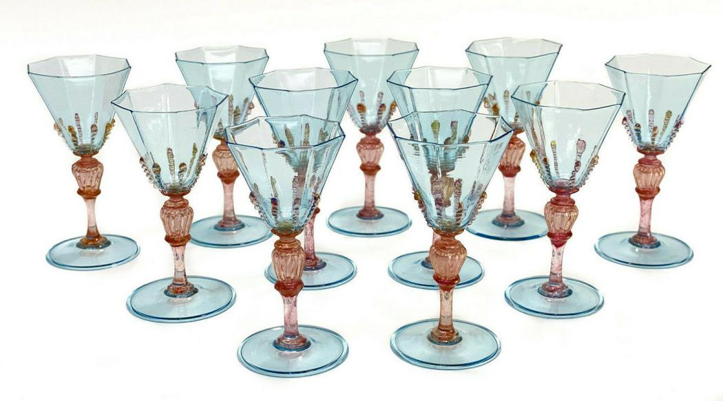 11 Salviati Cranberry Red & Blue Threaded Art Glass: 11 Salviati cranberry red & blue threaded art glass white wine goblets, circa 1940. Turquoise blue hues to the octagonal lobed bowls and base with a gold fleck cranberry red swirled stem and threaded 