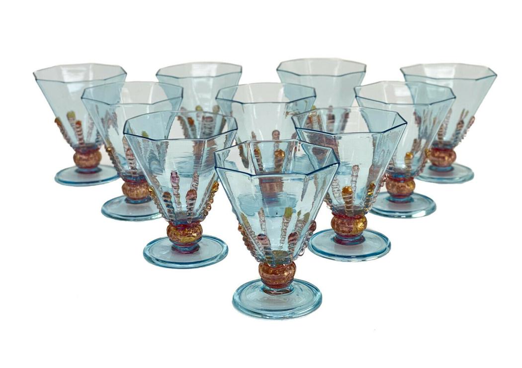 10 Salviati Cranberry Red & Blue Threaded Art Glass: 10 Salviati cranberry red & blue threaded art glass cordial wine goblets, circa 1940. Turquoise blue hues to the octagonal lobed bowls and base with a gold fleck cranberry red swirled stem and threade