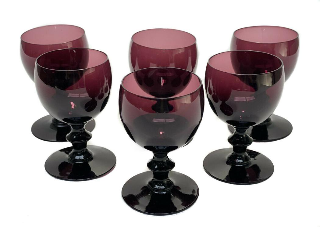 6 Purple Art Glass Cordial Wine Goblets: 6 amethyst purple art glass cordial wine goblets. Baluster stem to the goblets. Unmarked, attributed to Steuben. Weight Approx., 1.5 lbs Measures Approx., 2.5 inches diameter x 4 inches tall.Domestic
