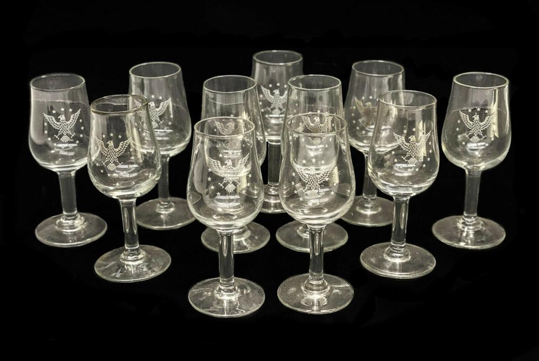 11 Pan Am Airlines Cordial Glass Presidential Eagle: 11 Pan Am Airlines 1st class cordial glass wine goblets. The central area of the goblets adorn the Presidential Eagle seal. Weight Approx., 1.5 lbs Measures Approx.,1.75 inches diameter x 4 inches tal