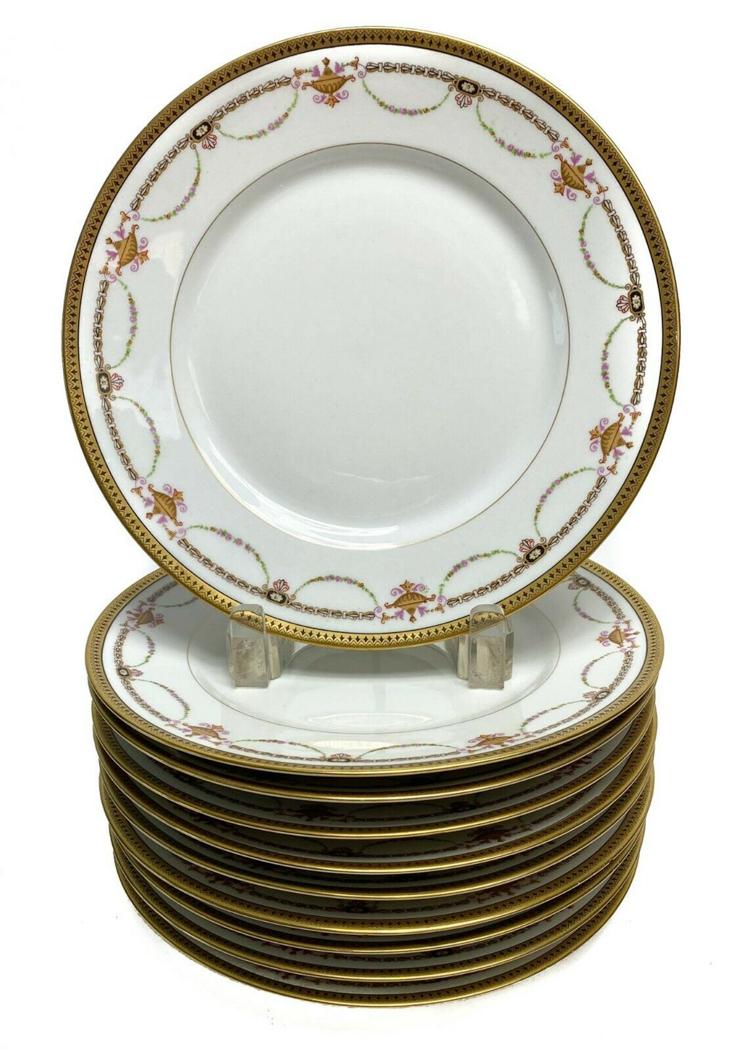 11 Bernardaud Limoges Porcelain Gilt Rim Dessert Plates: 11 Bernardaud Limoges Porcelain Gilt Rimmed Dessert Plates with Floral Swags c1910. Floral gilt swag decorations with a white ground. Weight Approx., 5.5 lbs Measures Approx., 7.2 in. diameter x 0.9 i