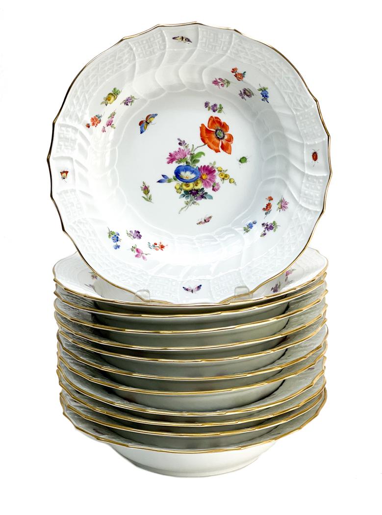 12 Meissen Germany Hand Painted Porcelain Rimmed Soup: 12 Meissen Germany Porcelain Rimmed Soup Bowls. Hand painted floral decorations with a basketweave texture to the scalloped rim. Meissen mark to the underside. Weight Approx., 9 lbs Measures Approx., 