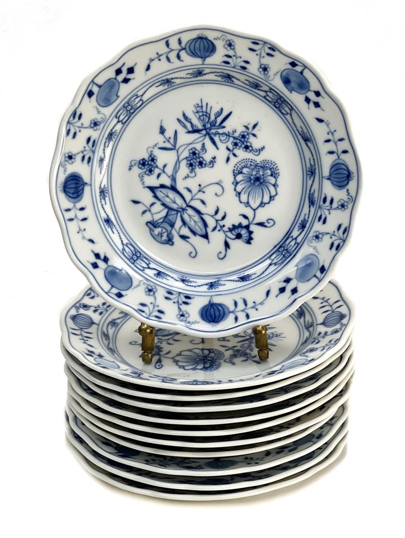 11 Meissen Germany Bread Plates in Blue Onion.: 11 Meissen Germany Bread Plates in Blue Onion. Florals to the center with onions to the scalloped rim. Meissen mark to the underside base. Weight Approx., 4 lbs Measures Approx., 6.25 inches diameter