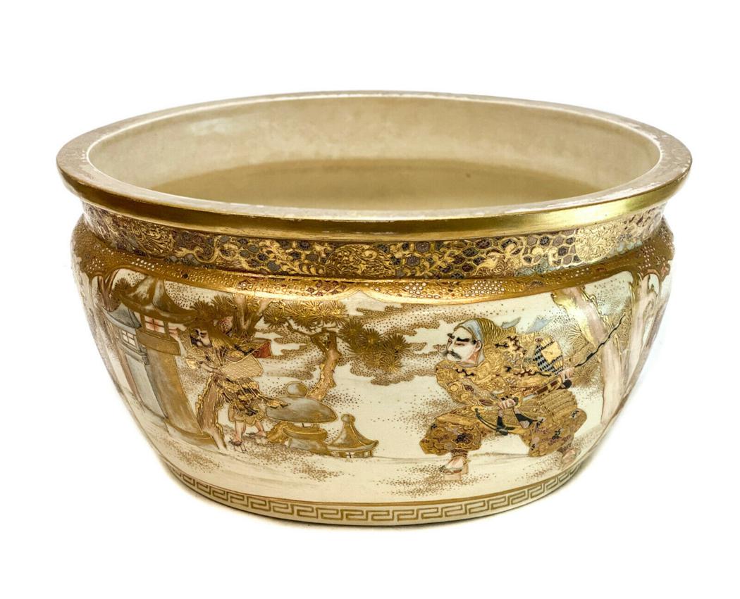 Japanese Satsuma Cachepot Centerpiece Bowl, Meiji: Japanese Satsuma cachepot or centerpiece bowl, Meiji Period. 1st half 20th Century. Gilt encrusted Japanese warriors to the central areas with gilt trees to the sides. Weight Approx., 10 lbs Measures 