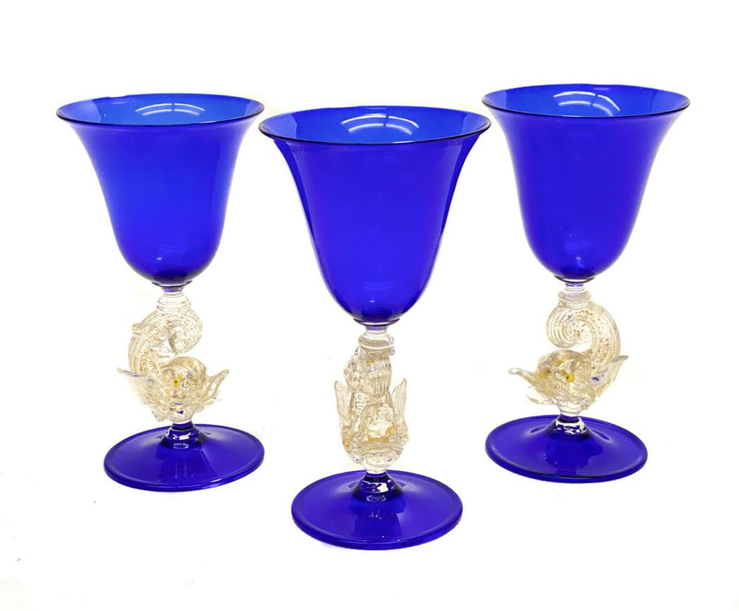 3 Salviati Venetian Cobalt Blue Art Glass Wine Goblets: 3 Salviati Venetian cobalt blue art glass wine goblets. Gold fleck dolphins to the stems. Weight Approx., 1.5 lbs Measures Approx., 3.625 inches diameter x 6.75 inches tall Shipping: 35.0