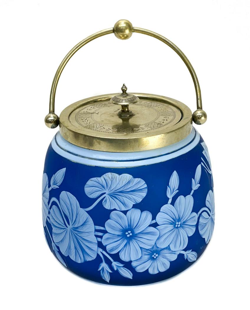 Thomas Webb Blue White Cameo Glass Silverplate Biscuit: Thomas Webb blue and white cameo glass and silverplate biscuit jar. Beautiful floral cameo to the exterior and engraved silverplate lid in the Aesthetic taste. Not signed, but with the signature Thoma