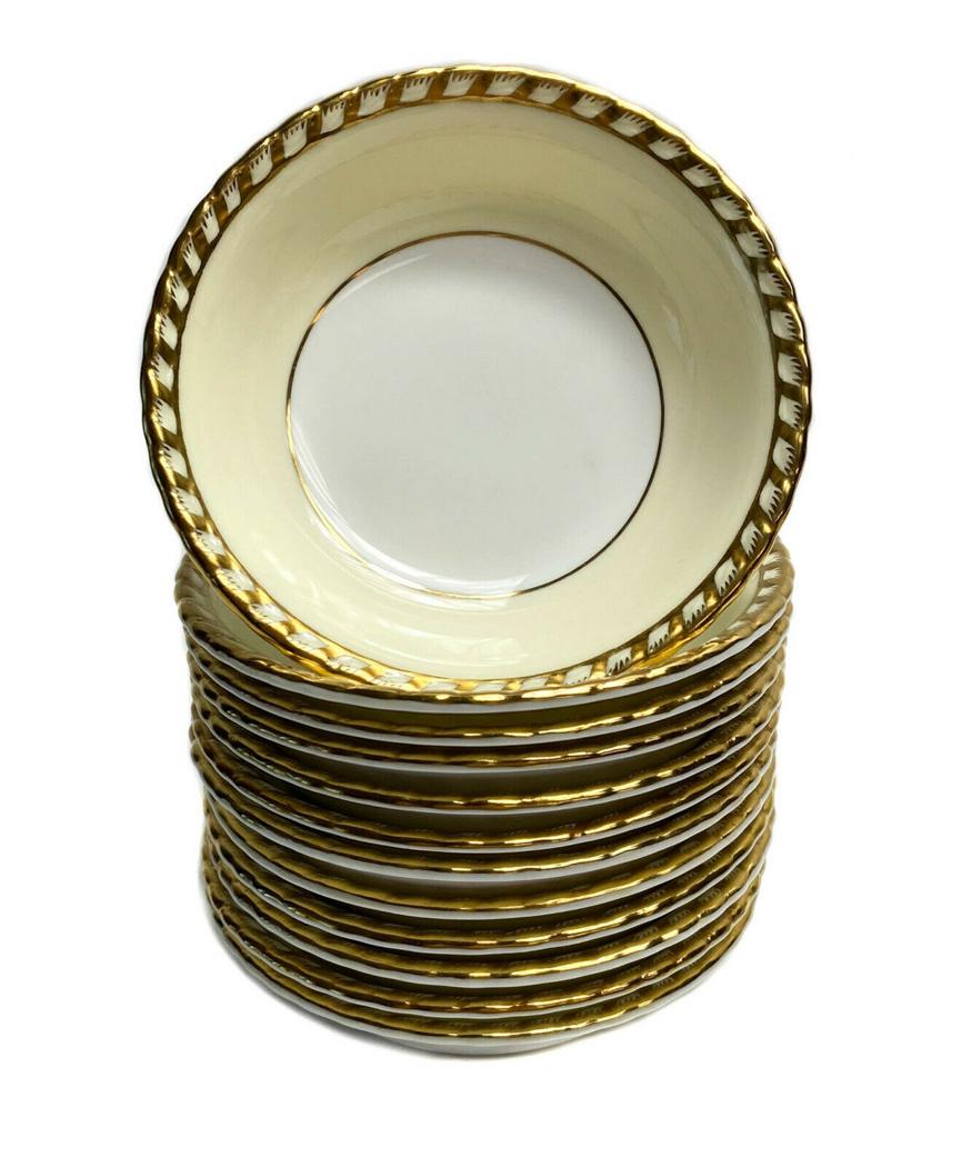12 Minton England Porcelain Berry Bowls: 12 Minton England porcelain berry bowls. A pale yellow ground with gilt to the scalloped edges. Minton England mark to the underside base Weight Approx., 4 lbs Measures Approx., 5.5 inches diameter x 