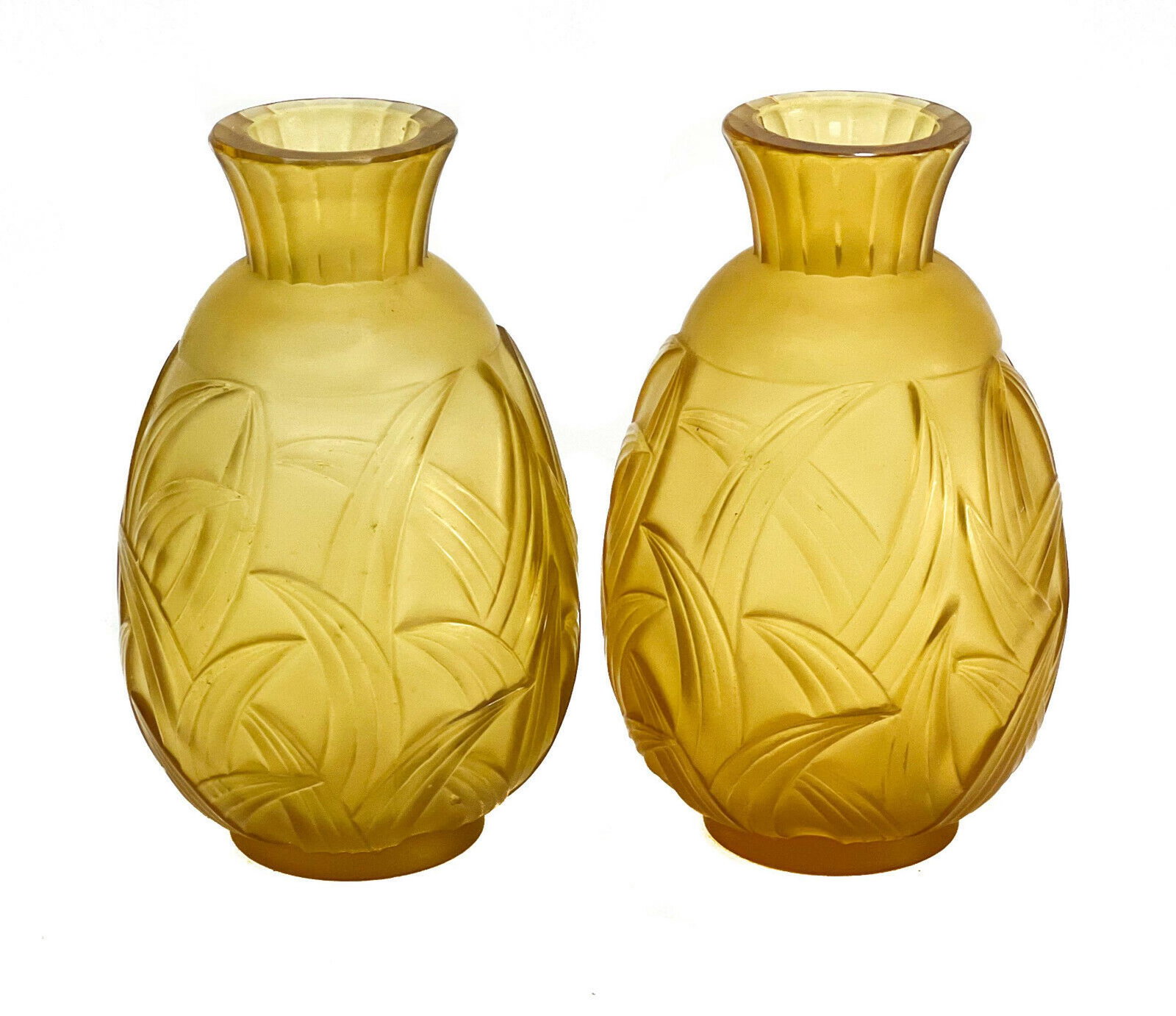 Pair Sabino Paris Amber Molded Glass Vases in Les: Pair Sabino Paris amber molded glass vases in Les Lianes. Fluted with molded leaf motifs to exterior. Signed Sabino to underside. Weight Approx., 0.5 lb Measures Approx., 3 inches diameter x 5 inches 