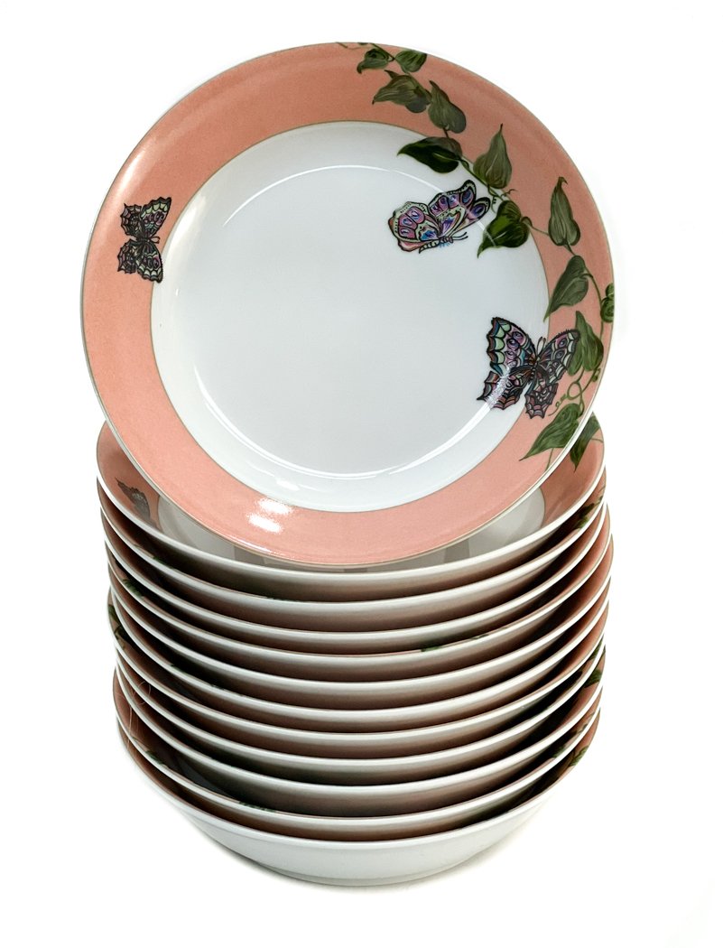 12 Christofle France Berry Bowls in Volubilis et: 12 Christofle France Berry Bowls in Volubilis et Papillons. A coral pink ground with butterflies flying through leaf vines. Christofle mark to underside. Weight Approx., 4 lbs Measures Approx., 5.75