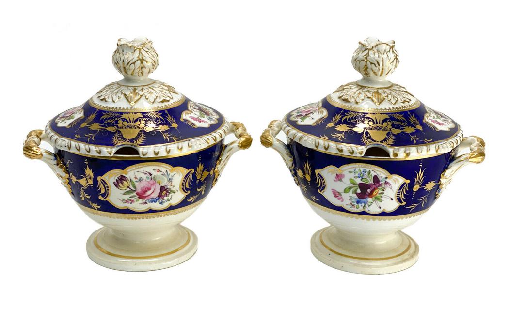 Pair English Derby Porcelain Sauce Tureens: Pair English Derby porcelain twin handled sauce tureens, 1st Half 19th Century. Cobalt blue ground with hand painted florals to the lid and body of the tureen. With a floral finial. A faded English De