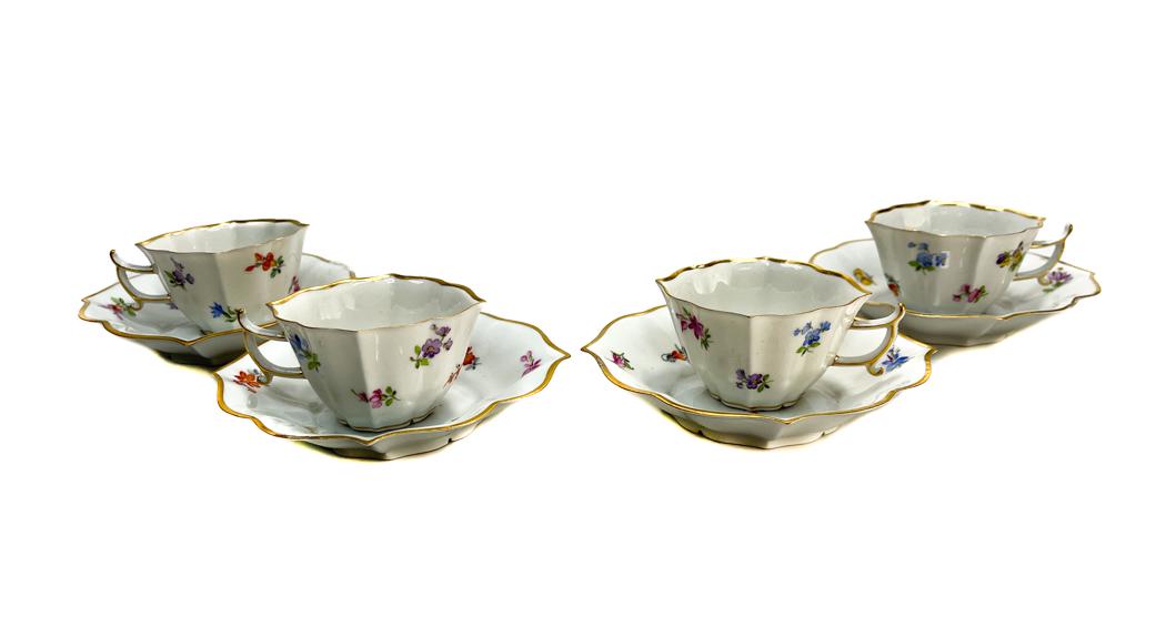 4 Meissen Germany Porcelain Cup and Saucers: 4 Meissen Germany hand painted porcelain scalloped cup and saucers. Hand painted scattered florals thoughout the exterior. Meissen mark to the underside base. Weight Approx., 1 lb Measures Approx., Cu