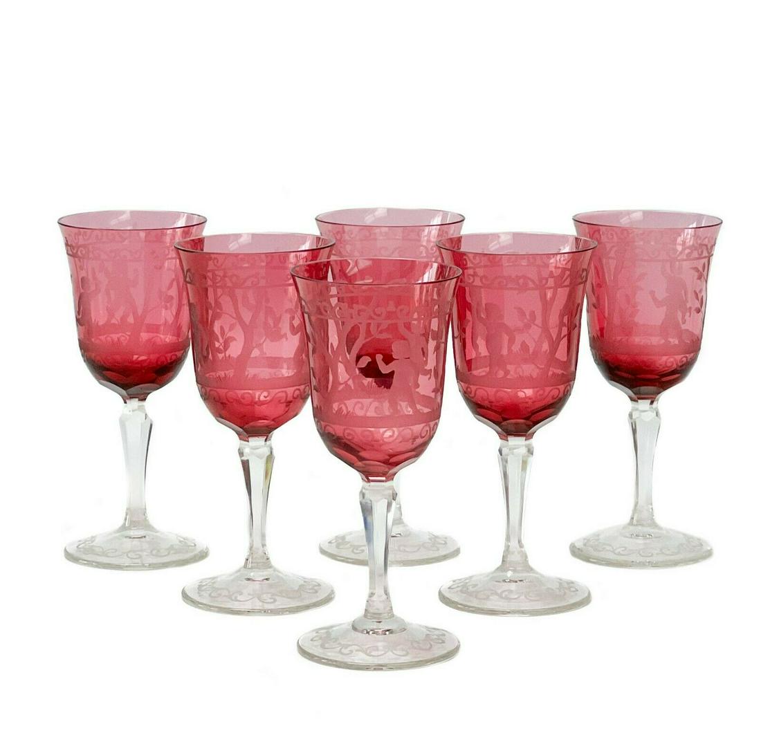6 Bohemian Cranberry Art Glass Engraved Stemware Wine: 6 Bohemian cranberry engraved art glass wine glasses. Cranberry colored glass with a band of engraved decoration featuring putti and trees around the center. Clear cut stems. Apparently unsigned, attr