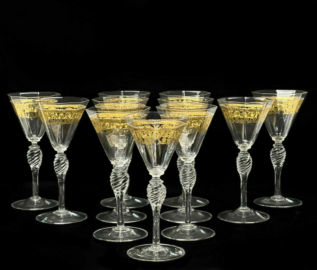 11 Venetian Hand Blown Glass Stemware Gilt & Enamel: 11 Venetian glass stemware gilt and enamel wine glasses, circa 1970. Octagonal shaped bowls with a gilt foliate design with raised enamel accents in white red and green. A twisted knobbed stem. Slight