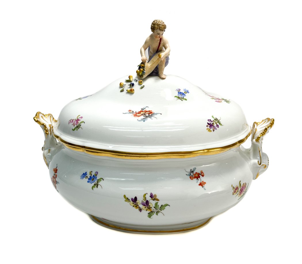 Meissen Germany Porcelain Tureen: Meissen Germany porcelain tureen Various hand painted scattered florals.The finial depicts a figural cherub holding a cornucopia filled with fruits. Meissen marks to the underside. Weight Approx.,5 lb