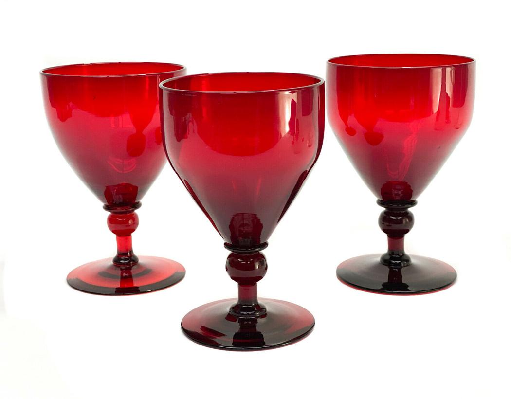 3 Steuben Selenium Red Glass Wine Goblets #3140: 3 Steuben selenium red glass wine goblets #3140. Bulbous stem. Polished pontil.Weight Approx., 0.5 lbs Measures Approx., 3.75 inches diameter x 6 inches tall.Domestic Shipping: $40